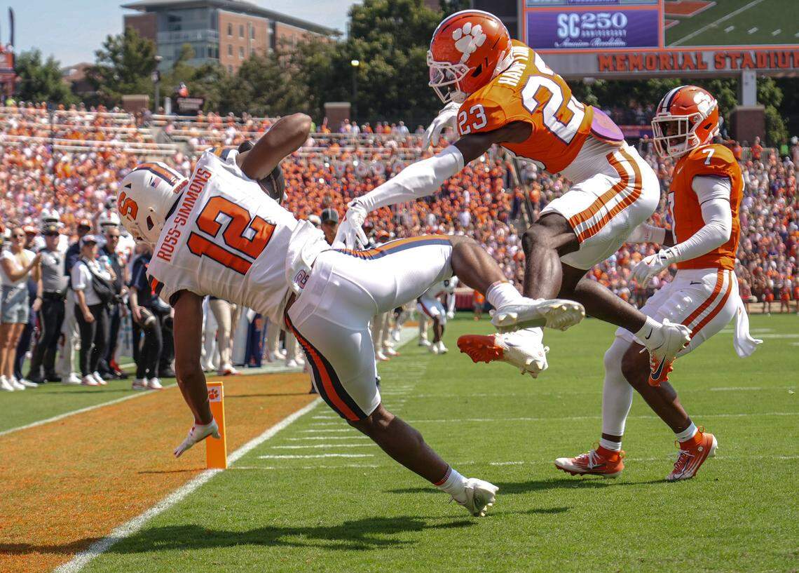 Syracuse Orange wide receiver Justus Ross-Simmons (12) catches a touchdown near Clemson Tigers cornerback Ashton Hampton (23) during the first quarter at Memorial Stadium.