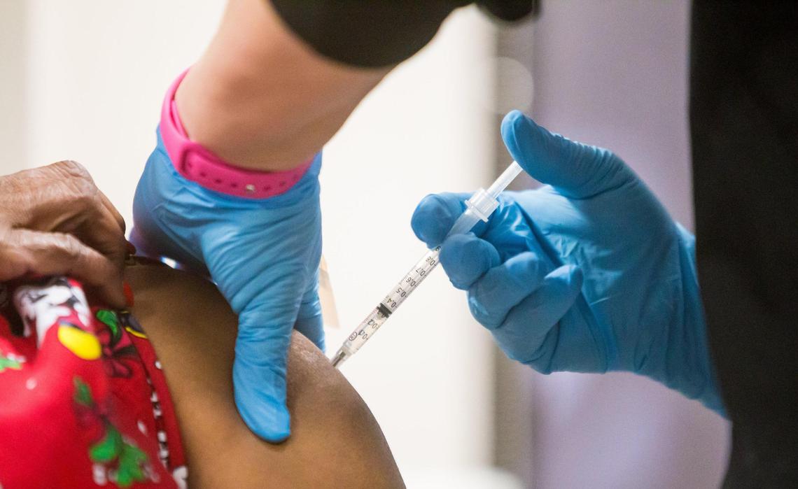 A member of Lexington Medical Center’s ER housekeeping staff, receives their second Pfizer-BioNTech vaccine.
