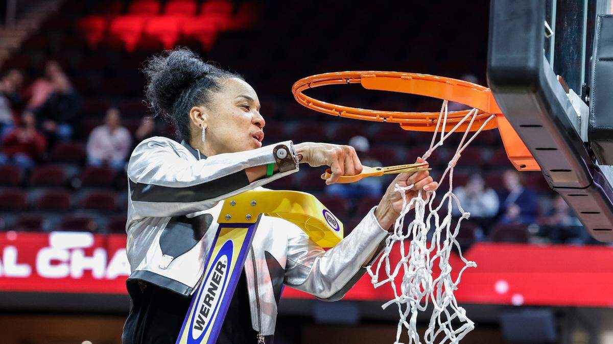 University of South Carolina Head Coach Dawn Staley cuts a piece of the net after winning the National Championship after beating Iowa at the Rocket Mortgage FieldHouse in Cleveland, Ohio on Sunday April 7, 2024.