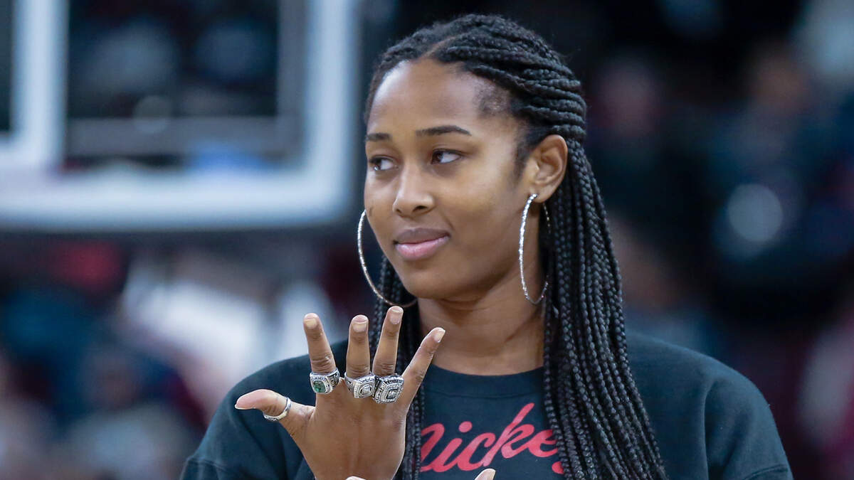 Alaina Coates admires the SEC championship ring she and other members of the 2017 team received. Coates is returning to professional basketball this year.