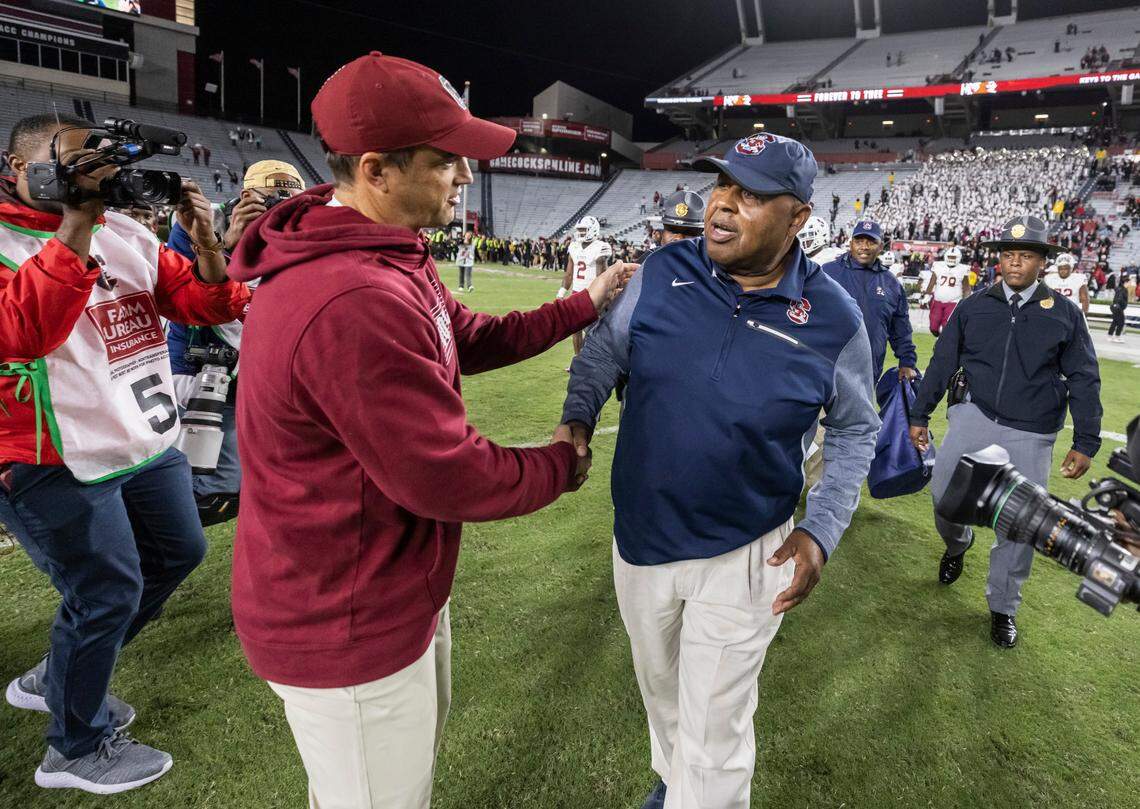 South Carolina Gamecocks head coach Shane Beamer speaks with South Carolina State Bulldogs head coach Oliver Pough after their game at Williams-Brice Stadium in Columbia, SC on Saturday, Sept. 29, 2022.