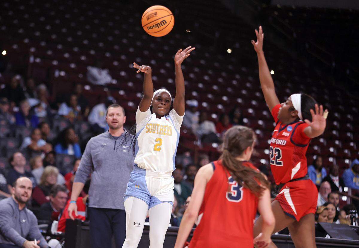 Southern's Jaylia Reed (2) shoots a 3-pointer against Samford during their NCAA Tournament First Four game Thursday at Colonial Life Arena.