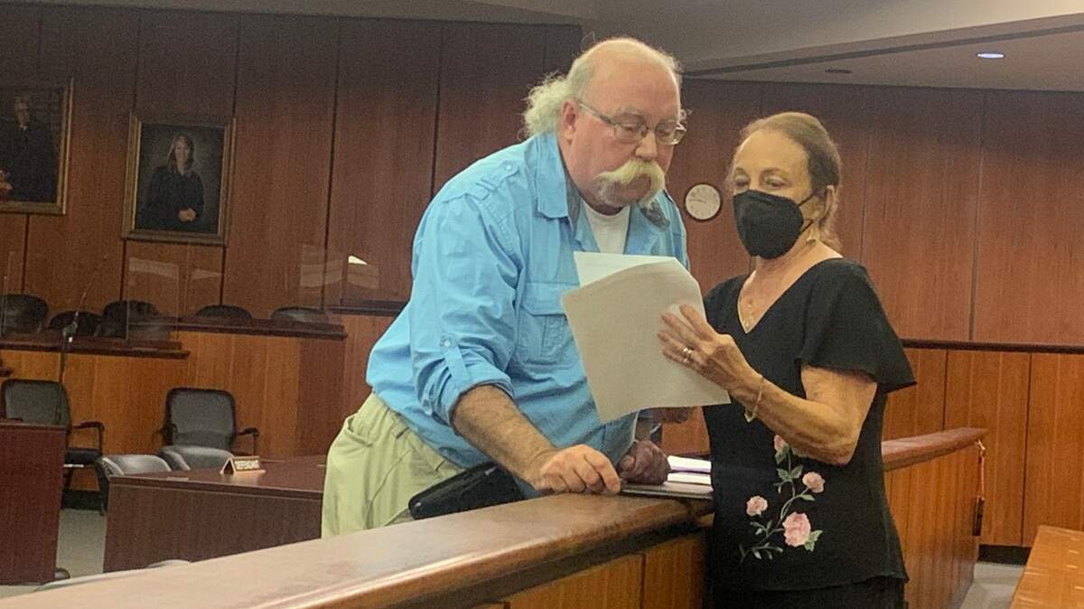 South Carolina Labor Party nominee for governor Gary Votour speaks with Labor Party Co-Chair Donna Dewitt during a hearing in Richland County in Columbia, S.C, on Tuesday, Aug. 16, 2022.