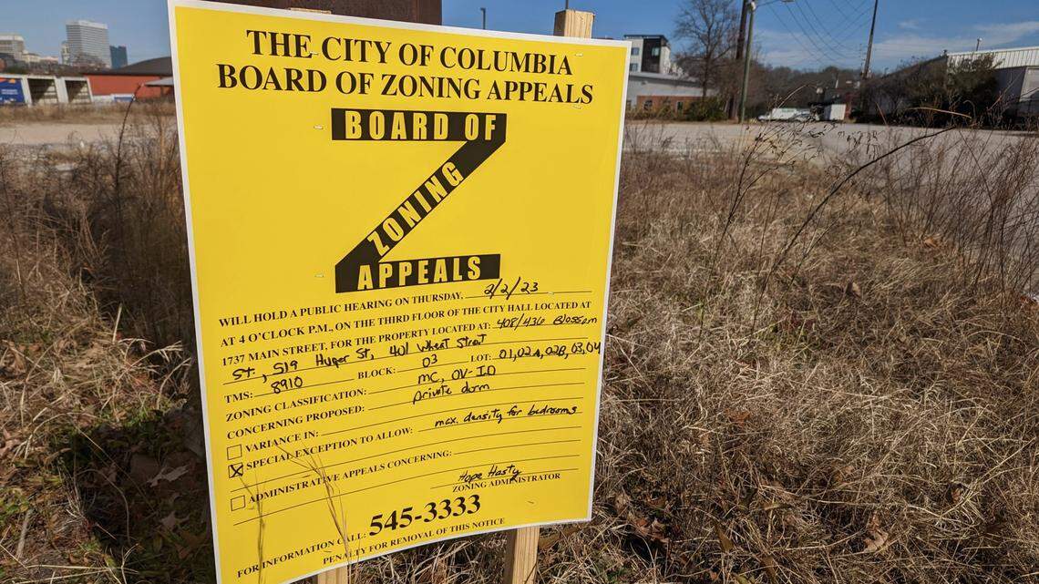 A rezoning sign sits at the property near USC’s baseball stadium where a new student housing development is planned.