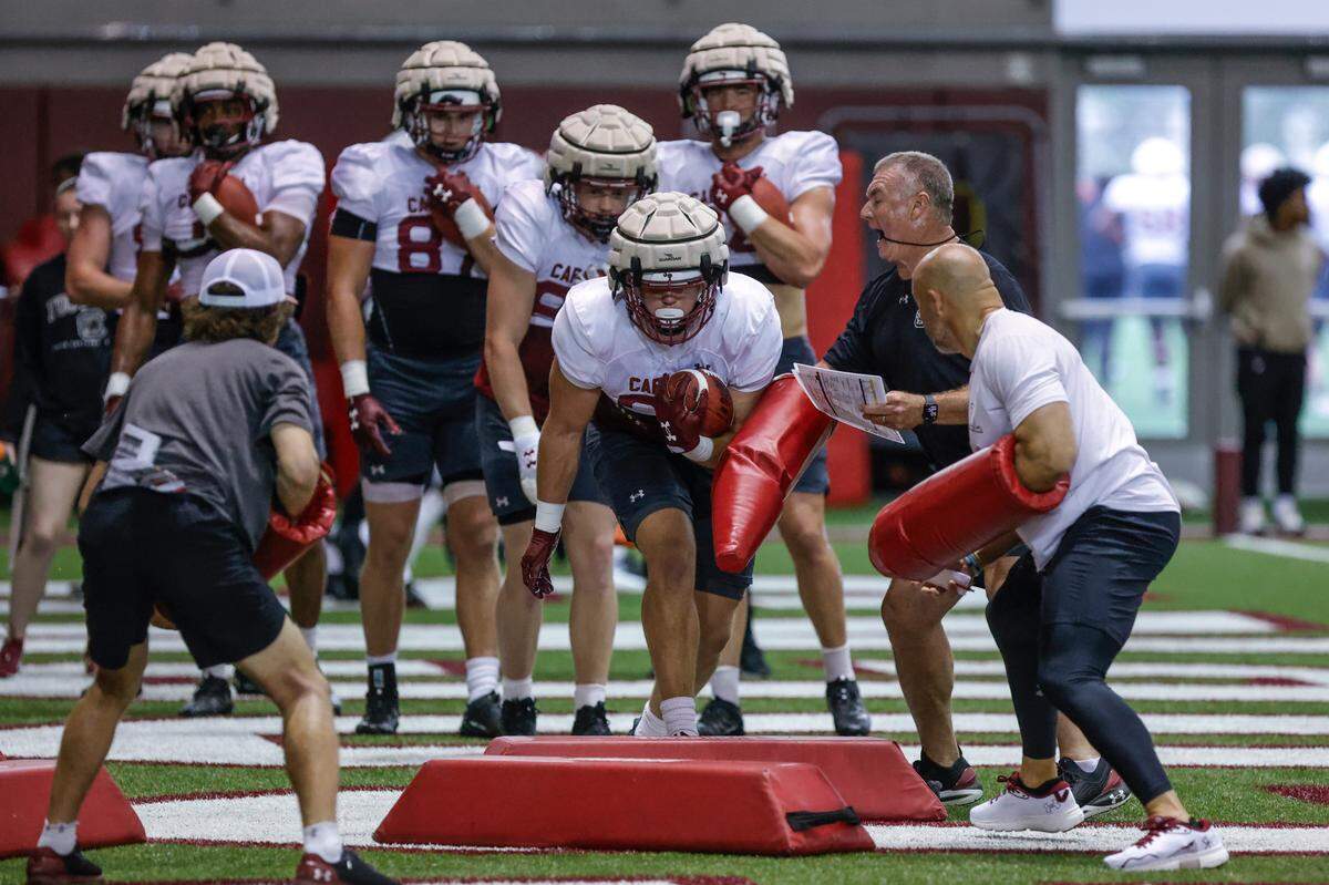 Tight end coach Shawn Elliott works with the tight ends during spring practice inside the Jerri and Steve Spurrier Indoor Practice Facility on Thursday, April, 11, 2024.
