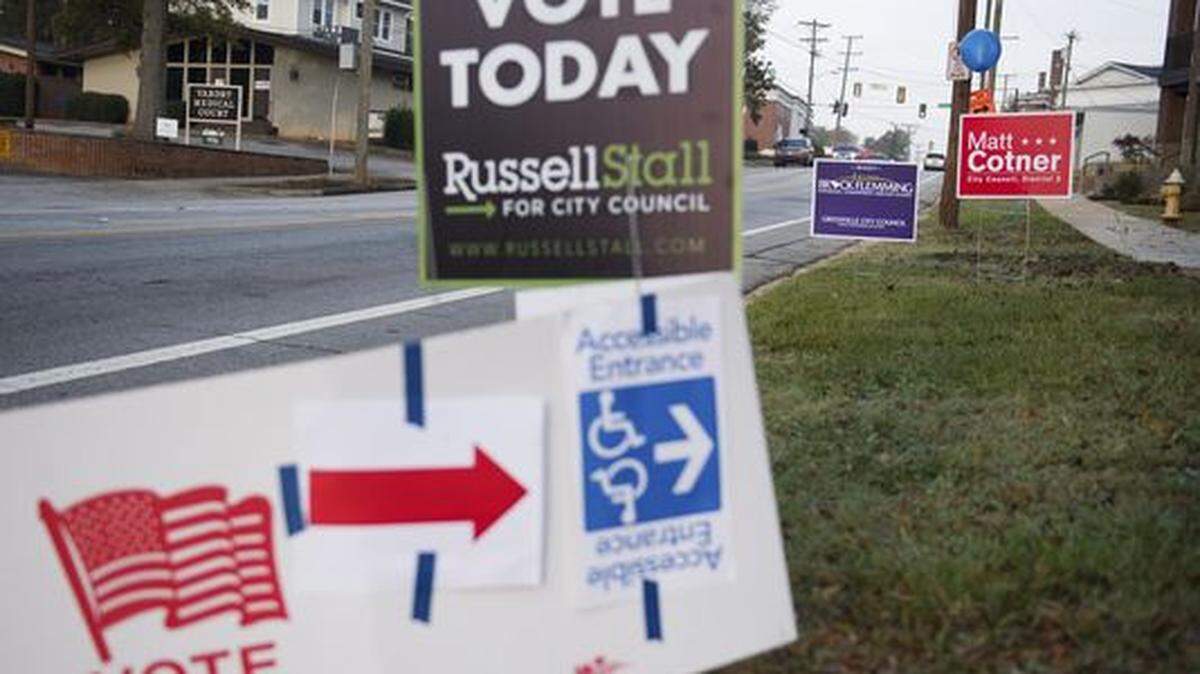 Campaign signs sit outside the West End Community Development Center in Greenville, SC, on Tuesday, November 7, 2017.