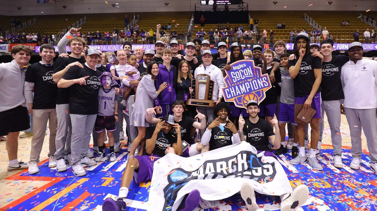 The Furman men’s basketball team celebrates after winning the SoCon tournament championship game on March 9, 2026 in Asheville. With the win, the Paladins advance to their second NCAA Tournament in four years.