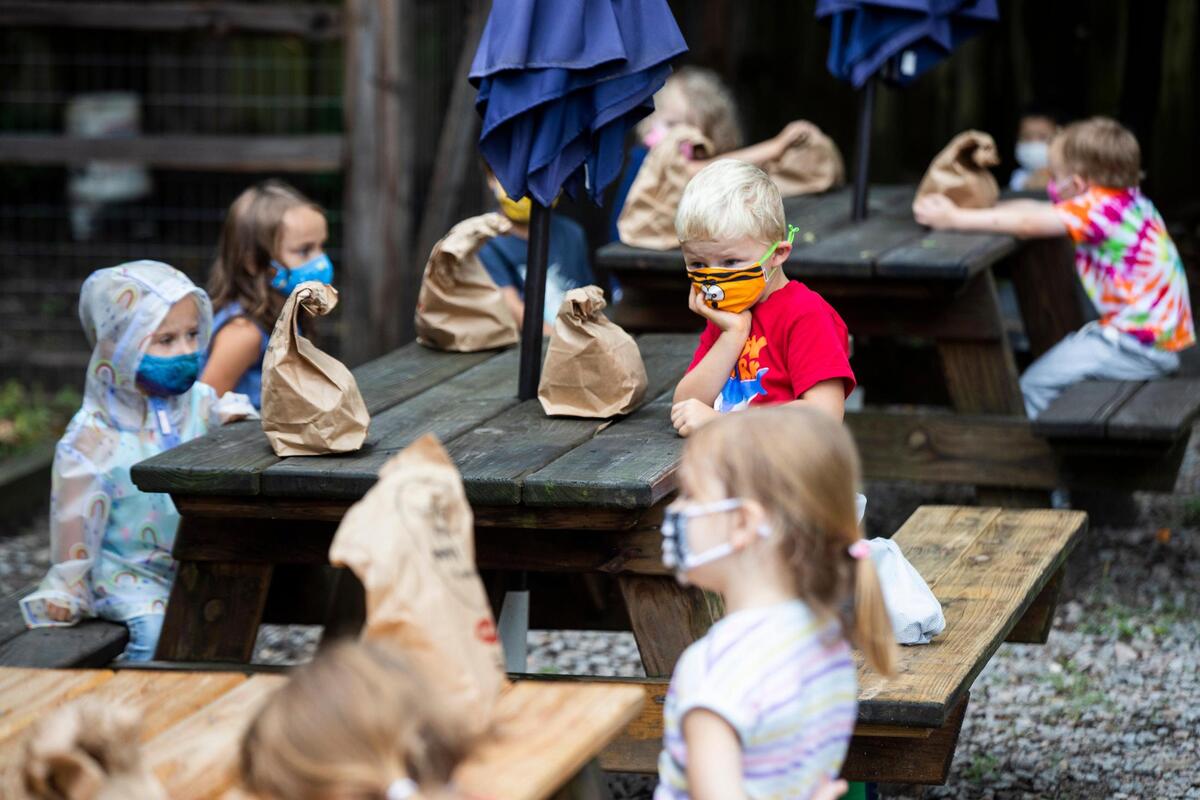 Students at Montessori School of Columbia wear masks before lunch on Friday, September 18, 2020. The private school received money through the Paycheck Protection Program and a Department of Social Services grant, but not through the CARES act due to restrictions in funding private schools. The school has spent a great deal of money building hand washing stations, purchasing additional masks and building more outdoor learning spaces to help students spend more time in well ventilated areas.