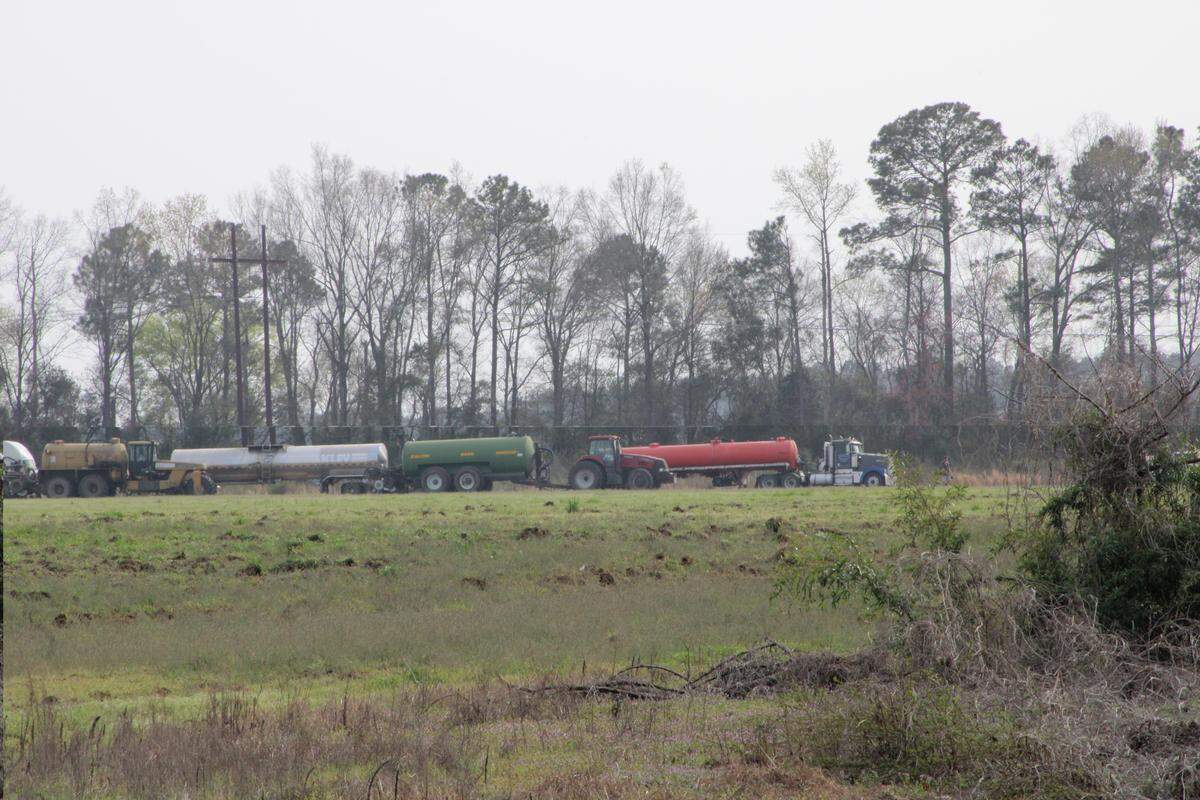 Sludge is often applied as fertilizer to farmland in South Carolina. It’s considered good for plant growth, but there are growing questions about whether toxic materials are in the sludge. This photo, from March 2023, shows a procession of trucks and heavy machinery involved in sludge spreading in Darlington County.