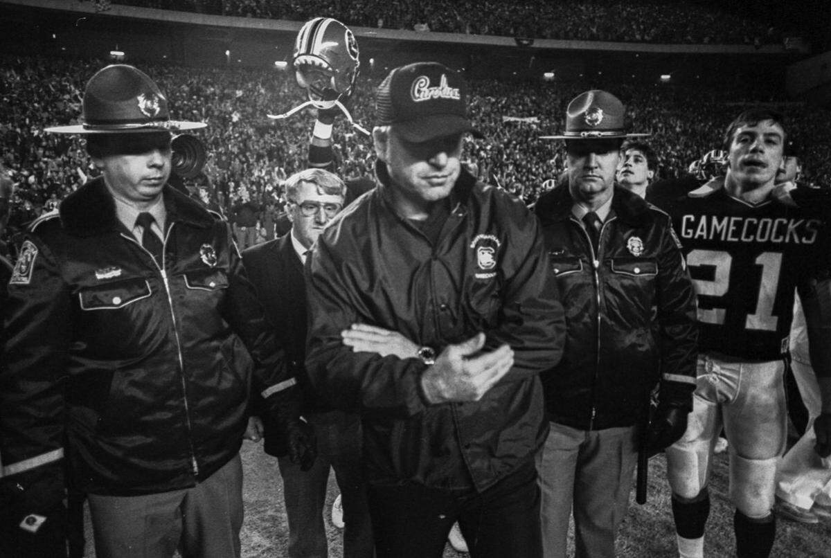USC football coach Joe Morrison exits the field following the USC vs. Clemson football game at Williams-Brice Stadium in 1987.