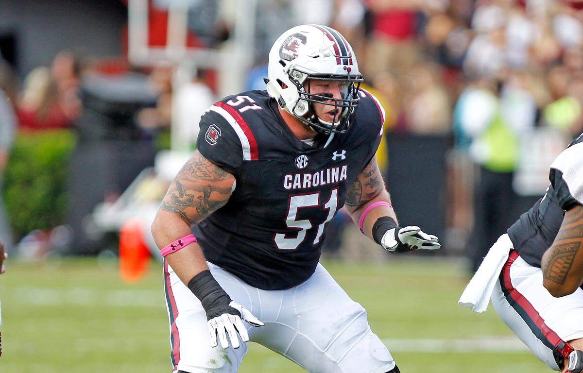 Former South Carolina football offensive lineman Cory Helms was named new football coach at Cardinal Newman.