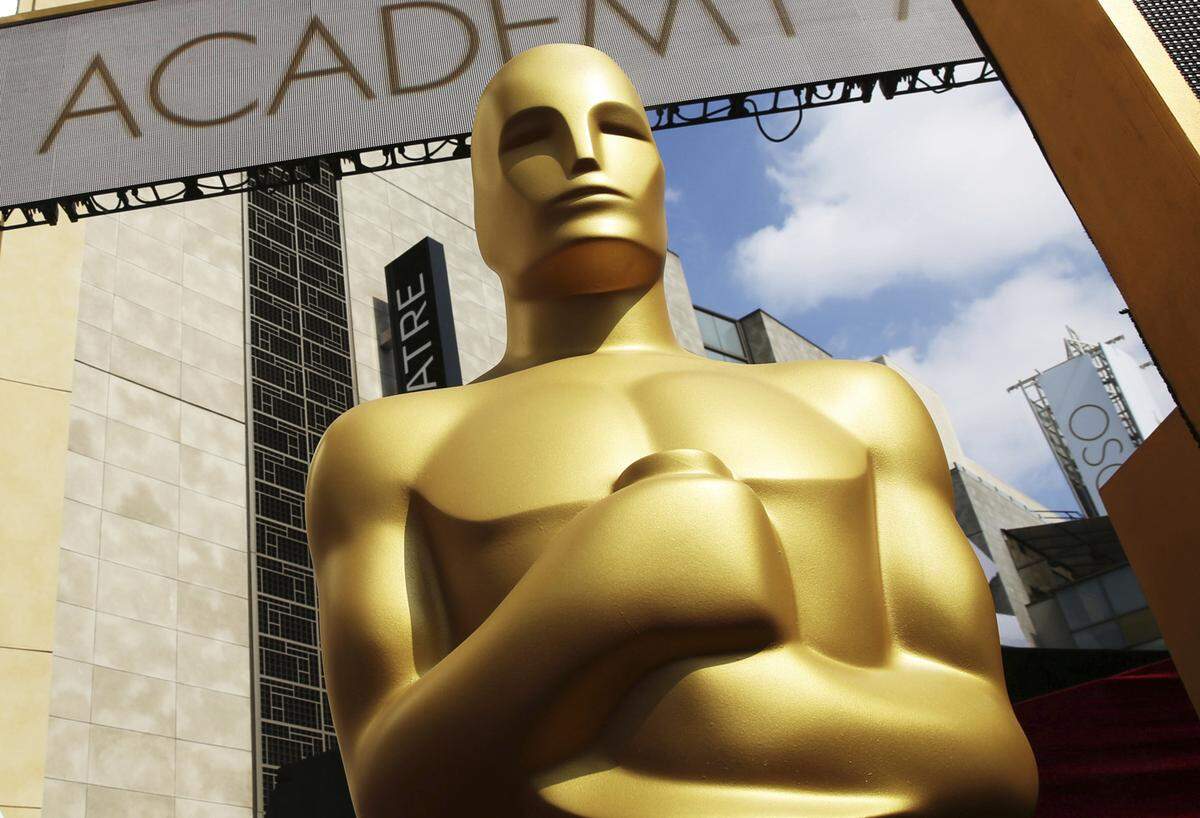 In this Feb. 21, 2015, file photo, an Oscar statue appears outside the Dolby Theatre for the 87th Academy Awards in Los Angeles. The 94th Academy Awards (2022) will be held on Sunday.