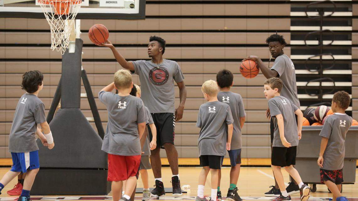 Jermaine Couisnard, left, and Keyshawn Bryant work with youngsters during the Little Gamecock basketball camp. About a 100 young boys participated in the Little Gamecock basketball camp at USC. 6/21/18