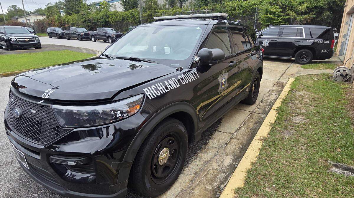 Exhibits mark a Richland County Sheriff’s Department patrol vehicle that was hit by gunfire five times following a high-speed chase on Tuesday, Sept. 30, 2025.