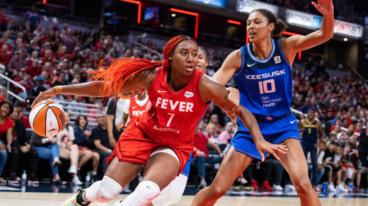 Indiana Fever forward Aliyah Boston (7) dribbles the ball while Connecticut Sun center Olivia Nelson-Ododa (10) defends in the second half at Gainbridge Fieldhouse.