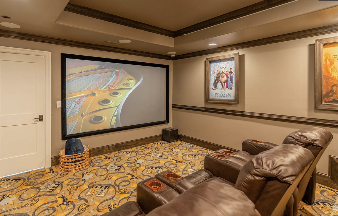 The terrace level of the Simpsonville, SC, home features a bedroom, bath, spa room with infrared sauna, state-of-the-art theater, climate-controlled wine cellar, and laundry as well as a commercial kitchen and pool bar.