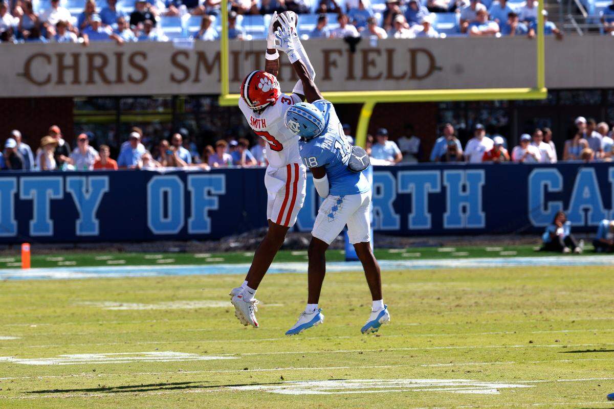 Tristan Smith #3 of the Clemson Tigers catches a pass against Jaiden Patterson #18 of the North Carolina Tar Heels during the first half at Kenan Memorial Stadium on October 4, 2025 in Chapel Hill, North Carolina.