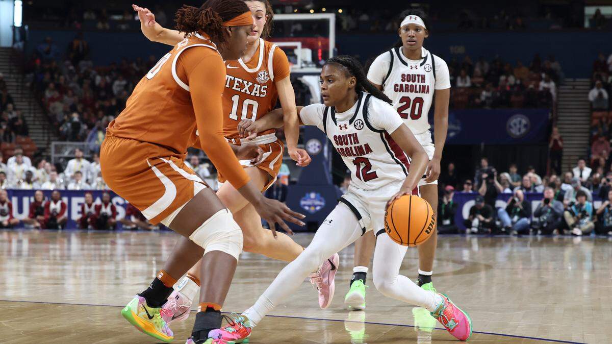 University of South Carolina’s MiLaysia Fulwiley (12) drives to the basket as Texas’ Kyla Oldacre (00) defends during the second half of action in the SEC Tournament at the Bon Secours Wellness Arena in Greenville on Sunday, March 9, 2025.