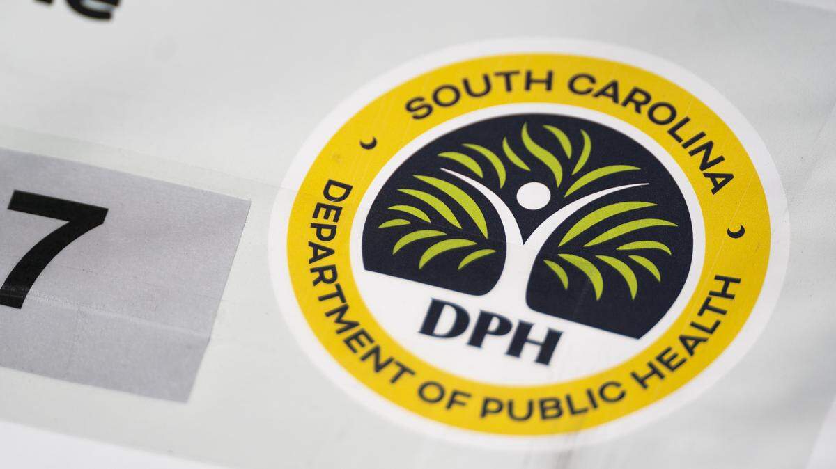 SPARTANBURG, SOUTH CAROLINA - FEBRUARY 6: A logo on a sign from the South Carolina Department of Public Health at a mobile clinic offering free measles vaccinations on February 6, 2026 in Spartanburg, South Carolina. The clinic offered vaccinations as the South Carolina Department of Health reported 876 cases of measles earlier in the week, most centered in Spartanburg County. (Photo by Sean Rayford/Getty Images)