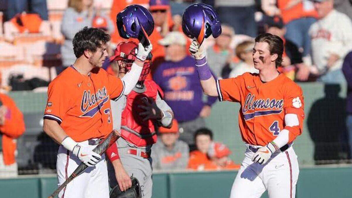 Clemson 9-hole hitter Benjamin Blackwell (4) and leadoff hitter Dylan Brewer touch bats following Blackwell’s second-inning home run against Indiana during the season opener on Friday, Feb. 18, 2022 at Doug Kingsmore Stadium in Clemson.