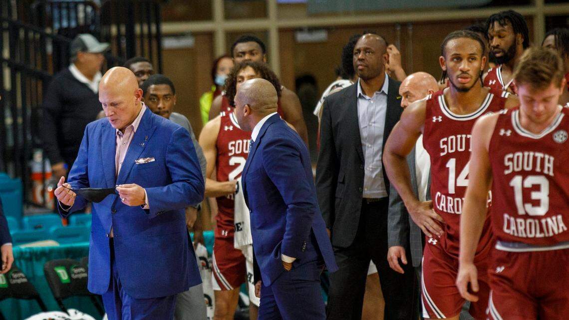 South Carolinas coach Frank Martin walks away from his players after a last second confrontation with Coastal’s players on Wednesday.