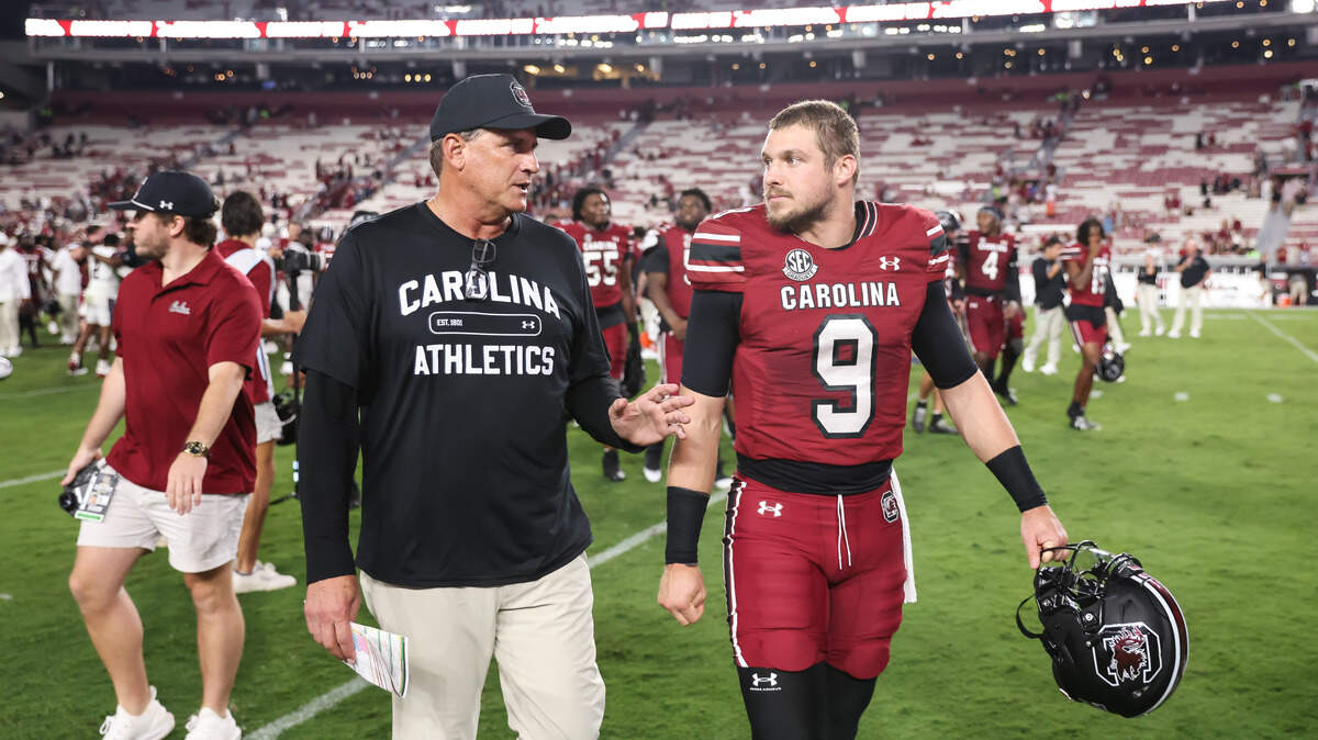 South Carolina quarterback Luke Doty (9) speaks with offensive coordinator Mike Shula following the Gamecocks’ game against South Carolina State at Williams-Brice Stadium in Columbia on Sunday, September 7, 2025.