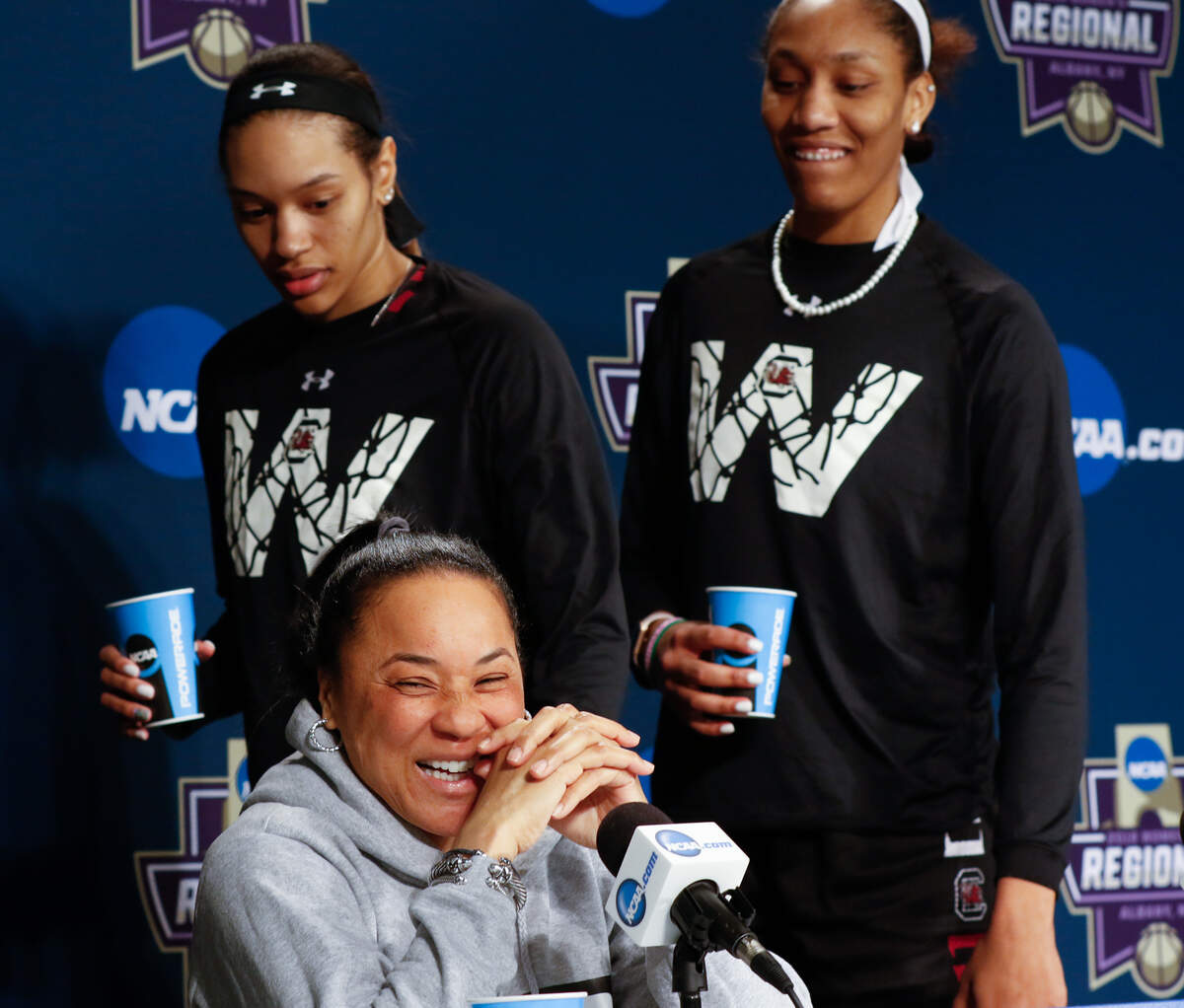 Alexis Jennings and A'ja Wilson kid with Coach Dawn Staley during a press conference at the Times Union Center in Albany, NY. The Gamecocks play the University of Connecticut for a spot in the Final Four.