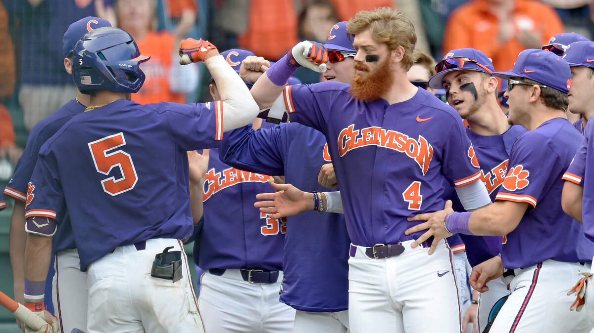 Clemson sophomore Sam Hall (5) rips a home run and is greeted by senior Grayson Byrd (4)and teammates at home plate. South Carolina faced Clemson in a baseball game at Fluor Field in Greenville Saturday, March 2, 2019 GWINN DAVIS / FOR THE STATE