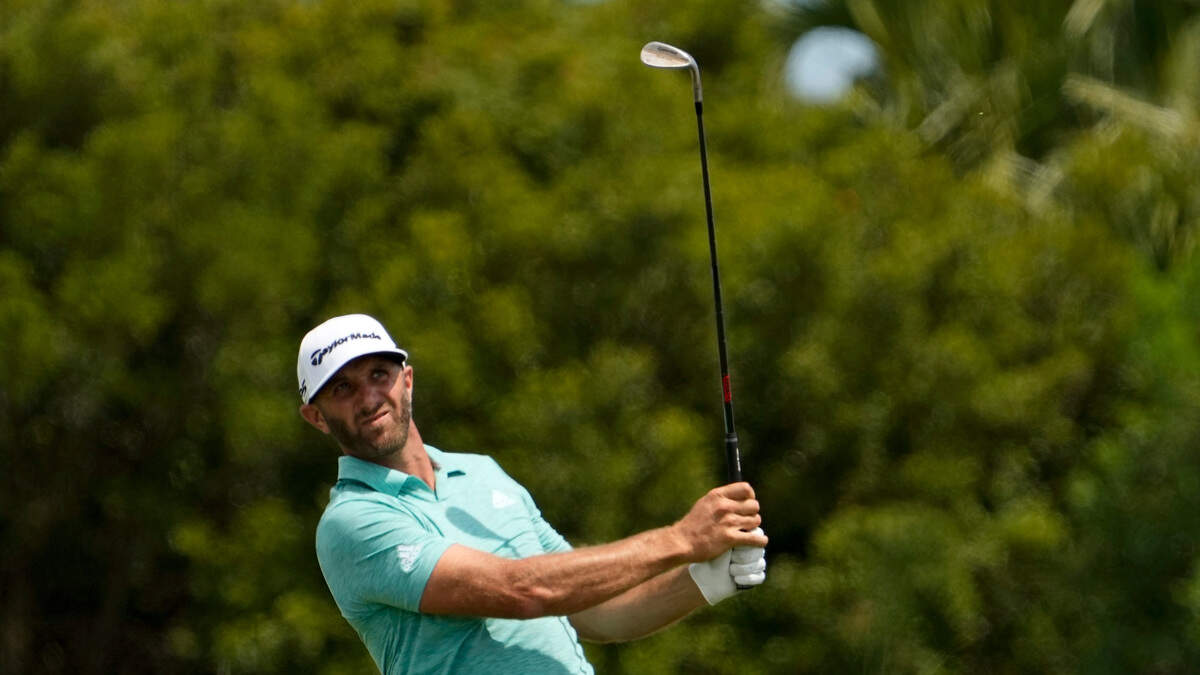 Dustin Johnson hits from the fairway on the sixth hole during a practice round at the PGA Championship golf tournament on the Ocean Course Tuesday in Kiawah Island.