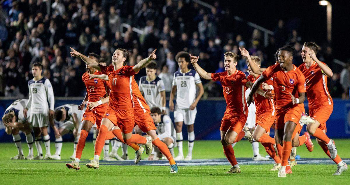 Clemson celebrates after defeating Notre Dame on penalty kicks after two overtimes in an NCAA men’s soccer soccer tournament semifinal in Cary, N.C., Friday, Dec. 10, 2021. (AP Photo/Ben McKeown)