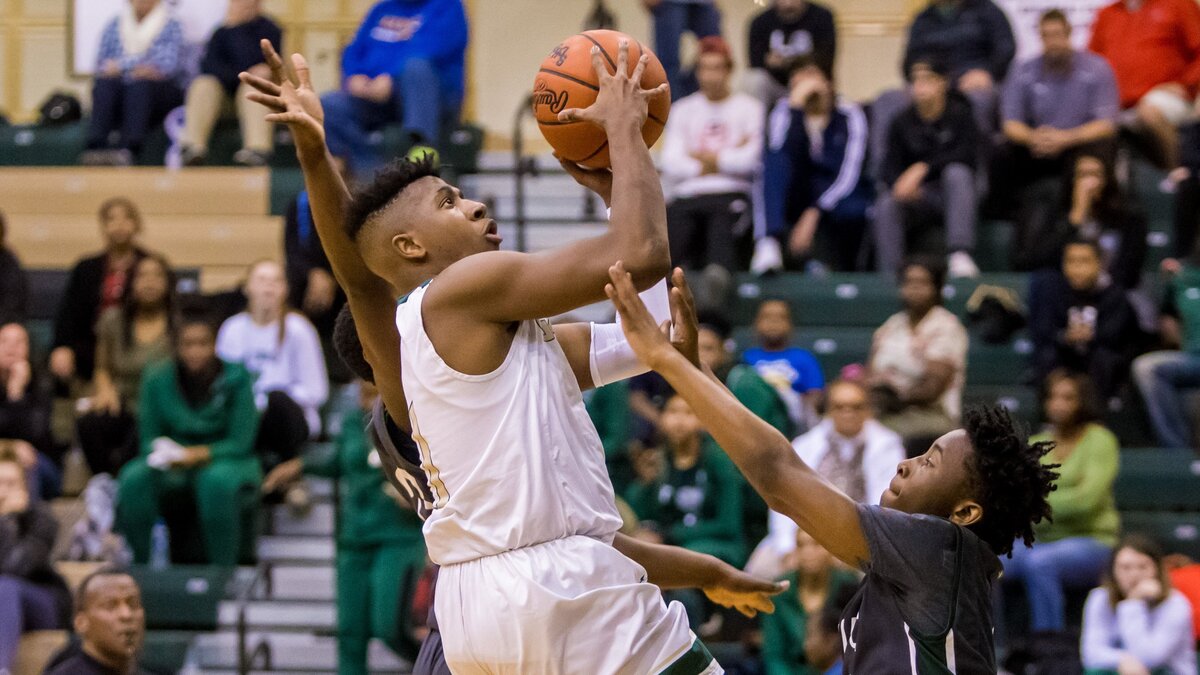 River Bluff Gators Terrill Windom (1) drives to the basket against Dutch Fork.
