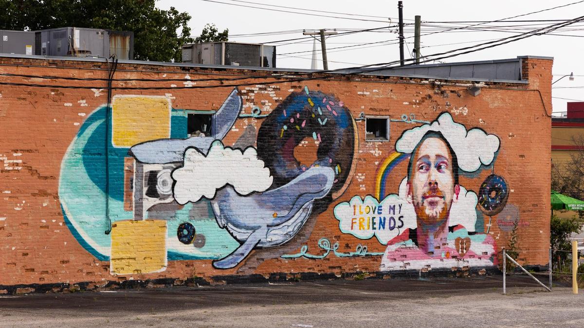 A mural of Aaron Graves, the lead singer of Columbia band Those Lavender Whales, on the side of the Hunter-Gatherer Alehouse on Main Street in Columbia, South Carolina. Graves died in 2019 of a brain tumor.