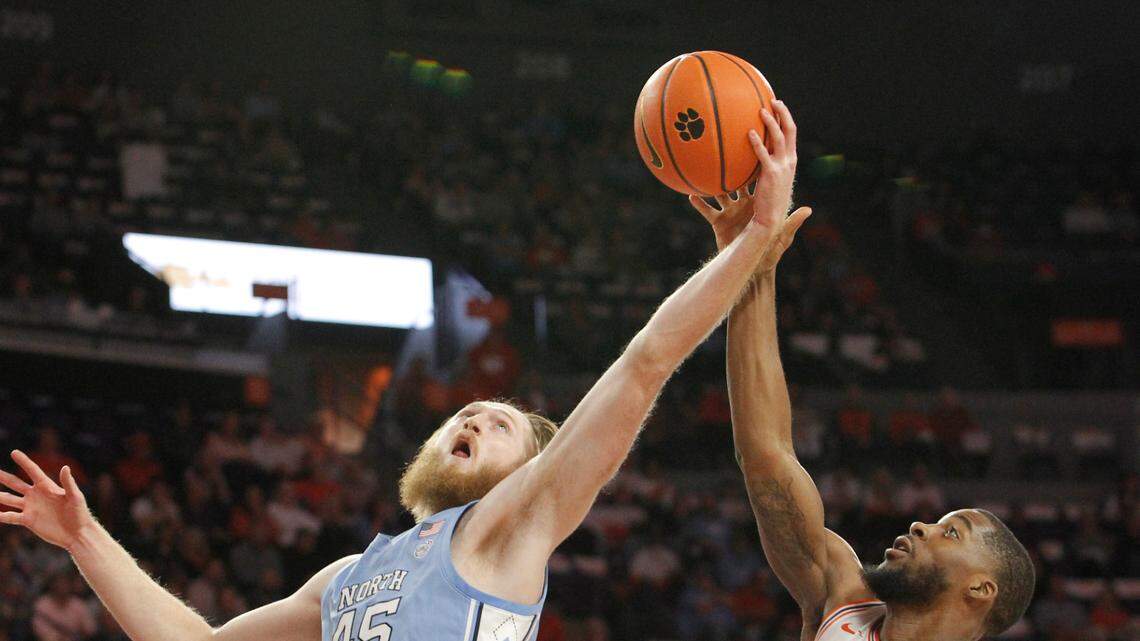 North Carolina forward Brady Manek (45) and Clemson forward Naz Bohannon (33) fight for a rebound during first-half action in Clemson, S.C. on Tuesday, Feb. 8, 2022. (Travis Bell/SIDELINE CAROLINA)