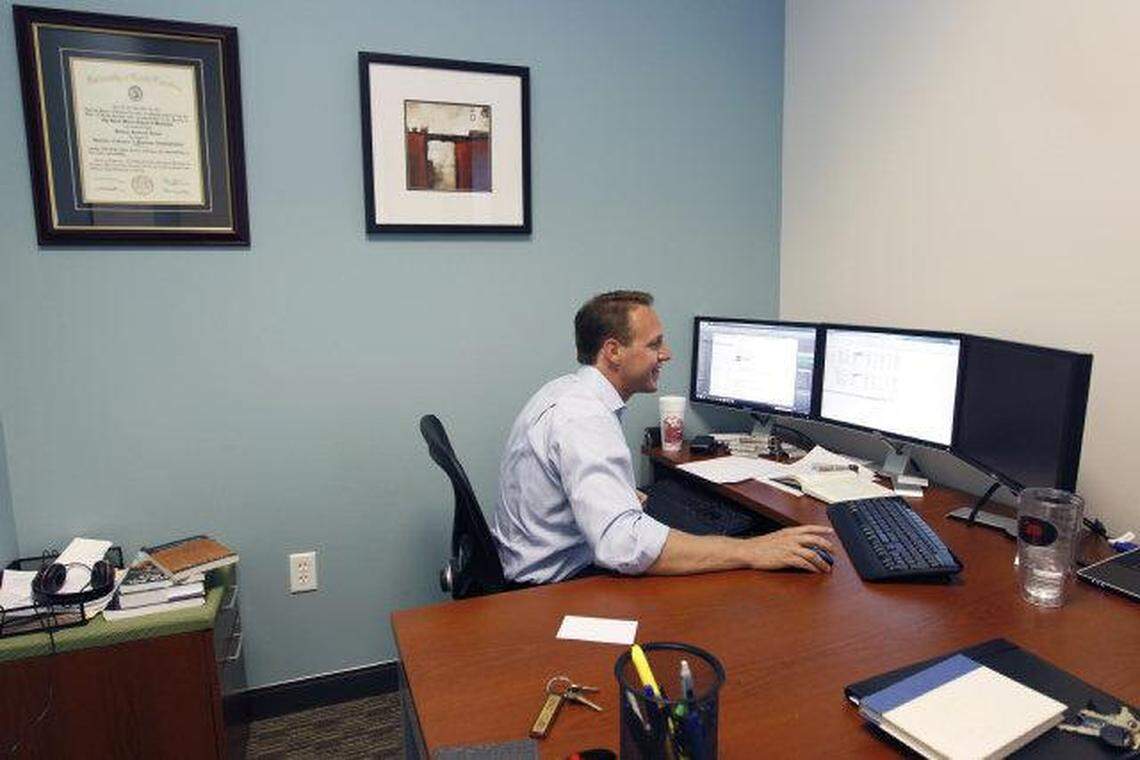 Brad House works in his office at the Regus business center in the Meridian building in Columbia. The center provides flexible office space rental and amenities including reception, a kitchen and dining area and a fitness room.