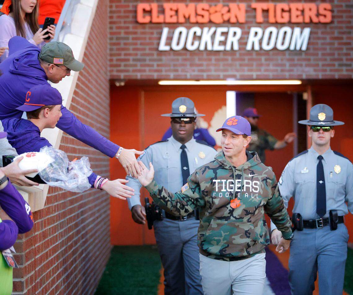 Clemson head coach Dabo Swinney is greeted by fans as he enters the field before The Citadel game in Clemson, S.C. on Saturday, Nov. 23, 2024.