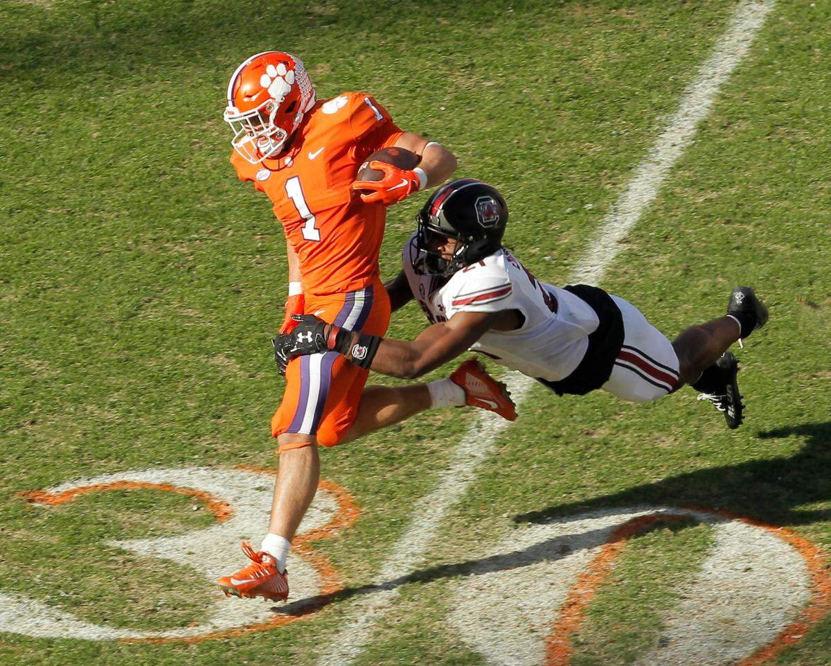 South Carolina defensive back Nick Emmanwori (21) takes down Clemson running back Will Shipley (1) during third-quarter action in Clemson, S.C. on Saturday, Nov. 26, 2022.