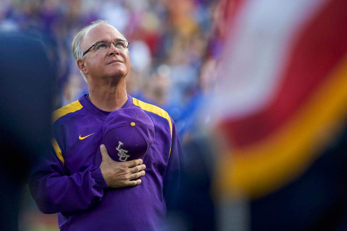Jun 26, 2017; Omaha, NE, USA; LSU Tigers head coach Paul Mainieri watches the military flyover during the National Anthem prior to the game agianst the Florida Gators in game one of the championship series of the 2017 College World Series at TD Ameritrade Park Omaha.