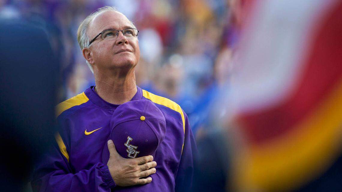 Jun 26, 2017; Omaha, NE, USA; LSU Tigers head coach Paul Mainieri watches the military flyover during the National Anthem prior to the game agianst the Florida Gators in game one of the championship series of the 2017 College World Series at TD Ameritrade Park Omaha.