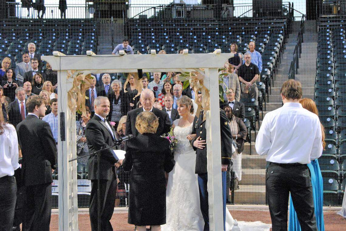 USC professor Annette Hoover, center, officiates a wedding planned by her class.