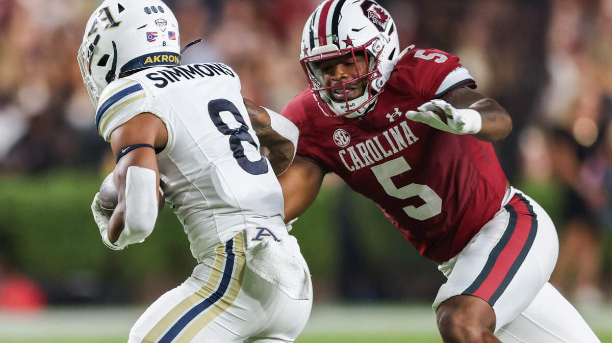 South Carolina edge Kyle Kennard (5) moves in to tackle Akron running back Jordon Simmons (8) during the first half of Gamecocks’ game against Akron in Columbia on Saturday, September 21, 2024.