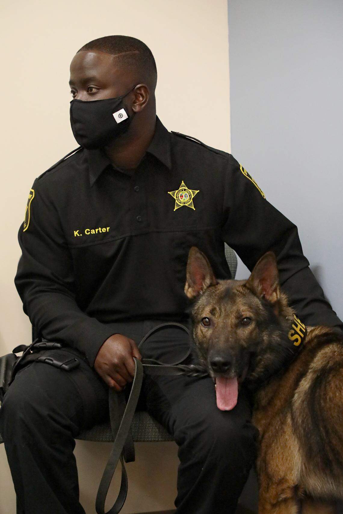 Cpl. Kirk Carter, and the newest member of the Sumter County Sheriff’s Office, K-9 Kilo, who was named in memory of Cpl. Andrew Gillette who died in the line of duty.