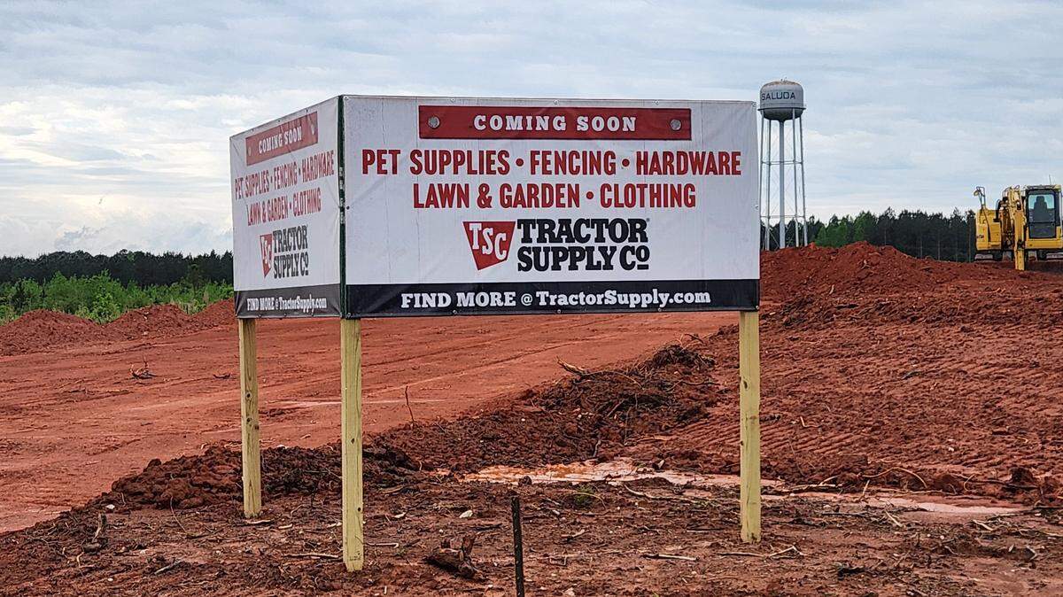 A sign announcing a Tractor Supply Co. store in Saluda County, SC.