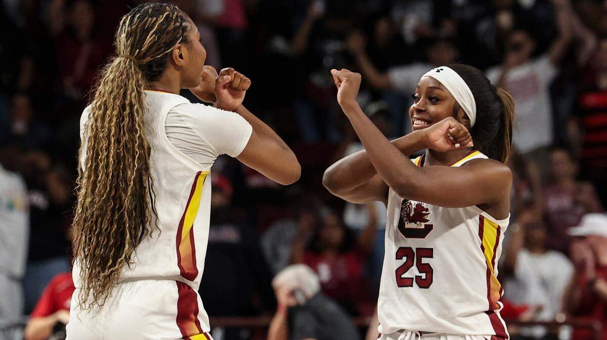 University of South Carolina’s Raven Johnson (25) dances with teammate Bree Hall (23) after the Gamecocks advanced to the Sweet 16 Round game of the NCAA Tournament at the Colonial Life Arena on Sunday, March 23, 2025.