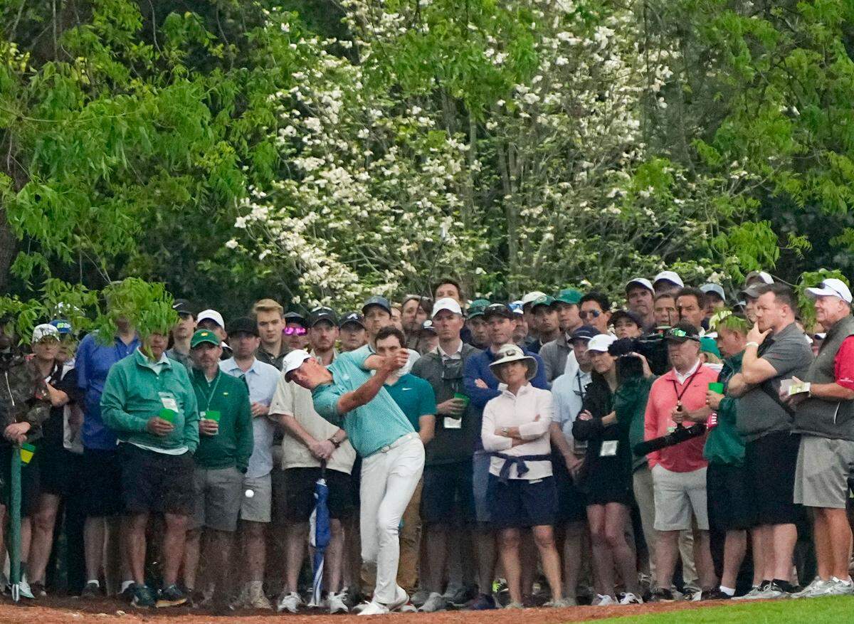Apr 11, 2024; Augusta, Georgia, USA; Christo Lamprecht hits out of the pine straw along the no. 2 fairway during the first round of the Masters Tournament. Mandatory Credit: Adam Cairns-USA TODAY Network