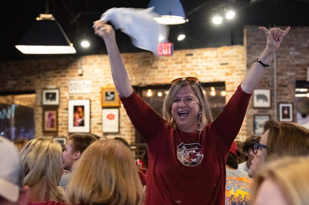 South Carolina fans celebrate the university’s women’s basketball team defeating Texas at Home Team Barbecue on Friday, April 4, 2025.