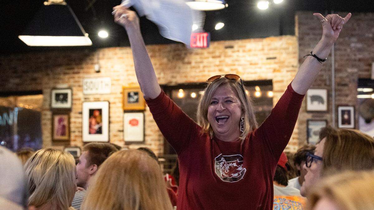 South Carolina fans celebrate the university’s women’s basketball team defeating Texas at Home Team Barbecue on Friday, April 4, 2025.