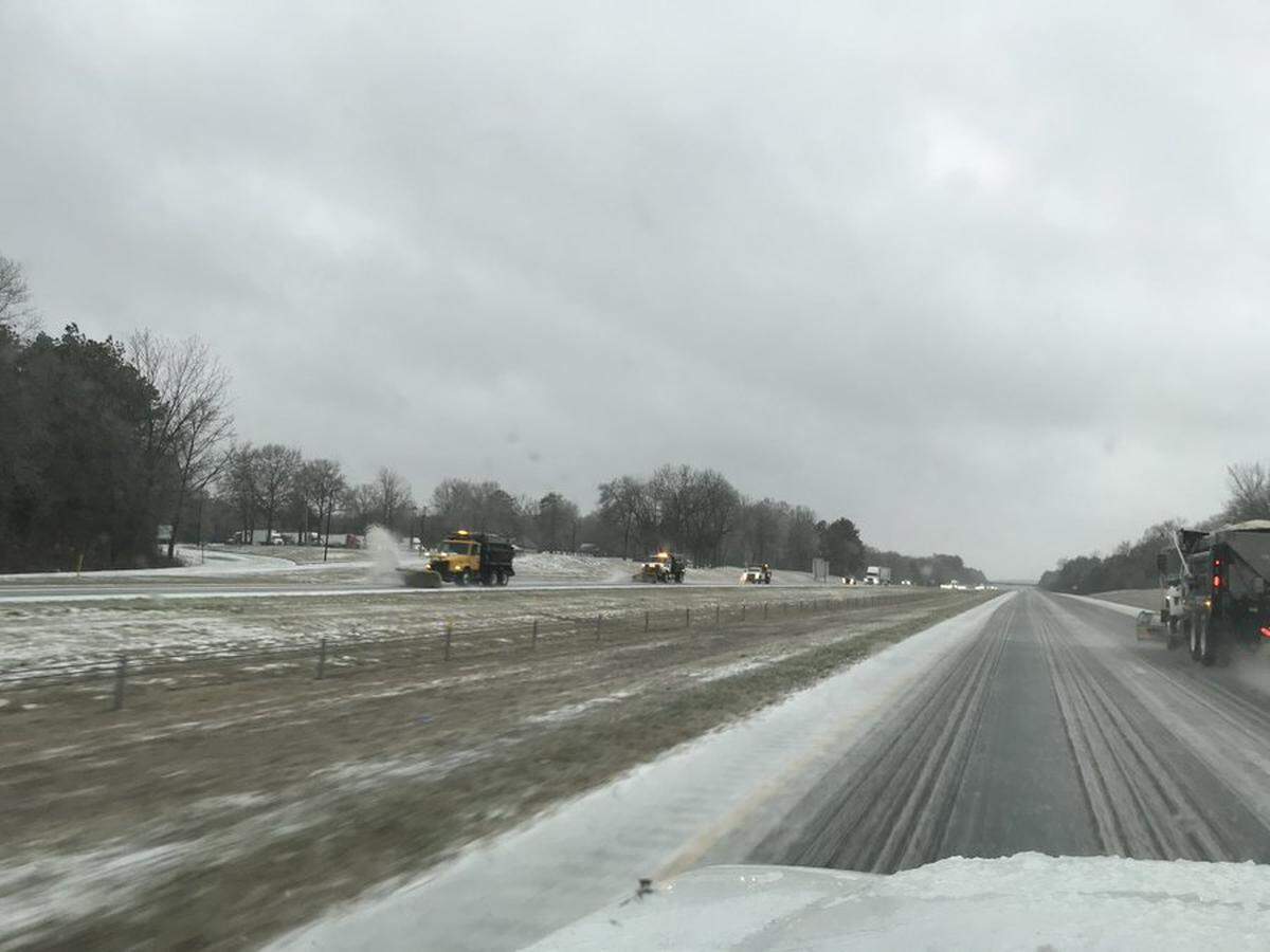 Plows work to clean highways and roads in the Midlands.