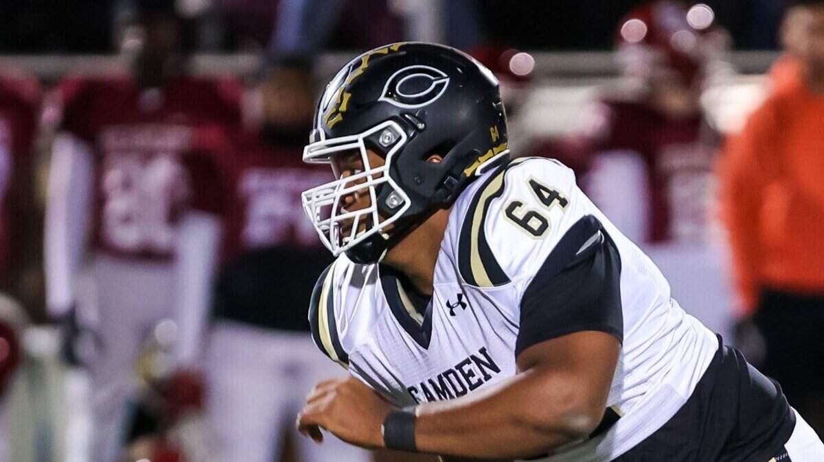 Camden Bulldogs defensive lineman Xzavier McLoud (64) rushes the passer against the Brookland-Cayce Bearcats in a playoff game Friday, Nov. 19, 2021 at Brookland-Cayce High School in Cayce, SC.