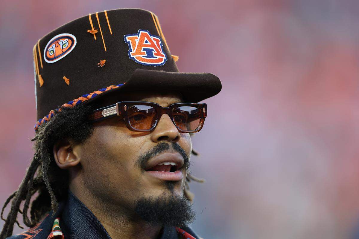 Former Auburn Tigers quarterback Cam Newton looks on during pregame warmups prior to the game between the Auburn Tigers and the Georgia Bulldogs at Jordan-Hare Stadium on October 11, 2025 in Auburn, Alabama.