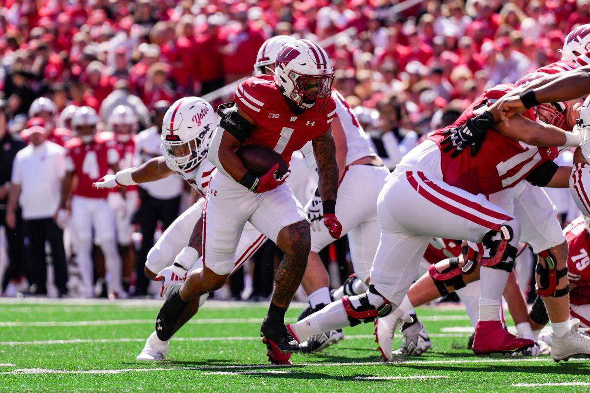 Sep 7, 2024; Madison, Wisconsin, USA; Wisconsin Badgers running back Chez Mellusi (1) rushes for a touchdown during the first quarter against the South Dakota Coyotes at Camp Randall Stadium.